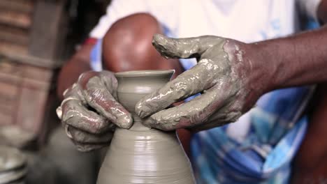 traditional diya made of clay and mud placed in sunlight at diya factory in rural india.