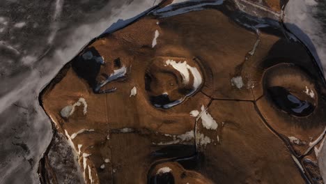 aerial view of frozen pseudocraters near skútustaðir village on mývatn lake in northern iceland