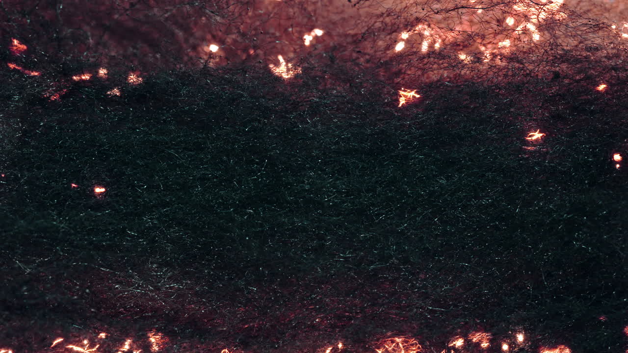 artistic long exposure of steel wool fire spinning