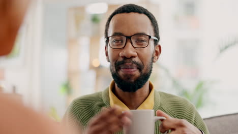 home, talking and black man drinking coffee