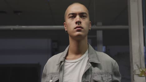 fashionable young man in an abandoned warehouse