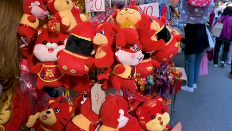 Chinese-buyers-shop-for-Chinese-New-Year-ornaments-and-gifts-at-a-street-market-stall-during-the-Lunar-Chinese-New-Year-in-Hong-Kong