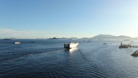 roro roll on-off vessel cruising slowly leaving hong kong bay