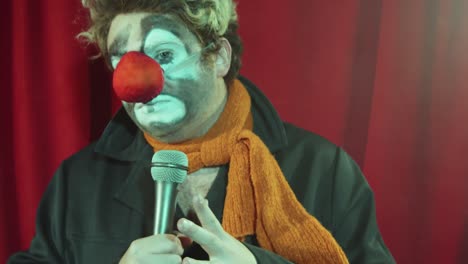 clown singing in mic on camera