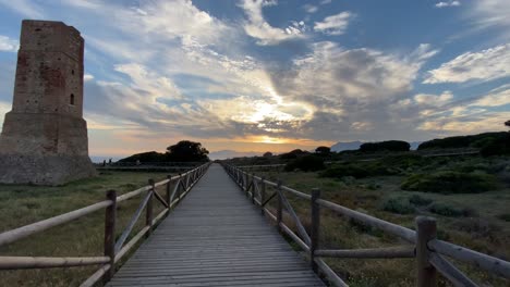 Walking on a wooden path on a southern Spanish beach in Marbella, with stormy skies.