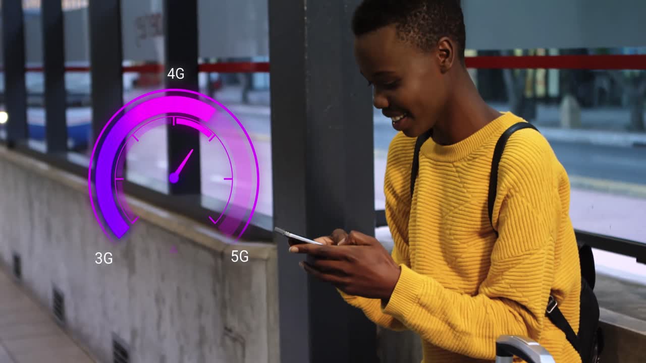 Animation of purple speedometer over happy african american boy using smartphone