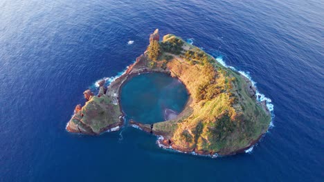 scenic islet of vila franca with its round crater lagoon in azores, aerial