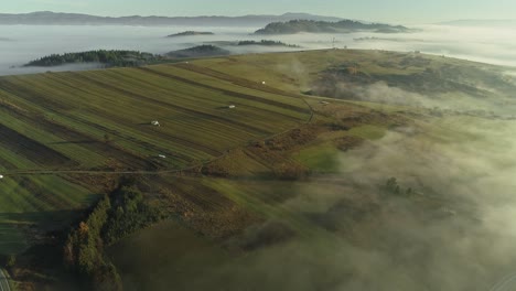Fog-over-cultivated-fields.-Aerial-backward-tilt-down