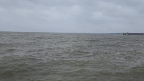 This-is-a-video-of-a-large-ocean-bay-with-rough-waves-during-an-afternoon-storm