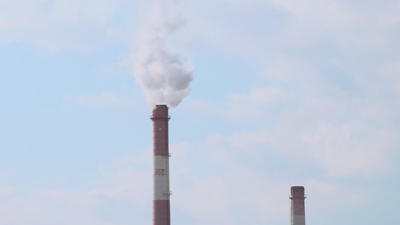 Smokestack Releasing White Smoke Against Sky, Tall Red Brick Chimney Emits Dense Plume With Secondary Stack . Media