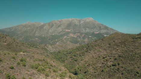 forward aerial view of mountains near istan, marbella, spain