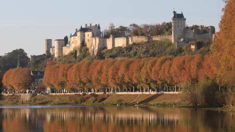 the river vienne and the city of chinon, france. sitting on the banks of the river vienne, the city of chinon is famous for its wine and castle. it is in the unesco world heritage site loire valley.