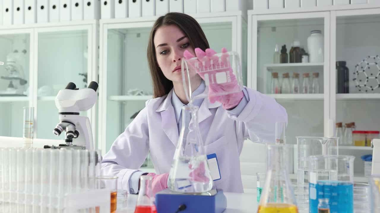 Scientist in Lab Conducting Experiment