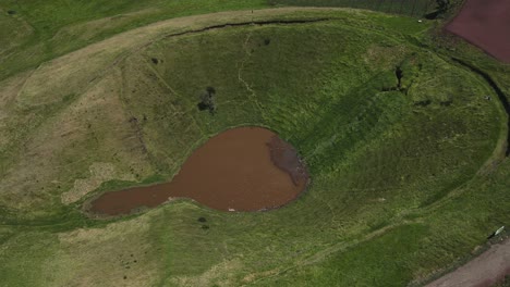 orbital shot of la olla crater lake in a volcanic valley in costa rica