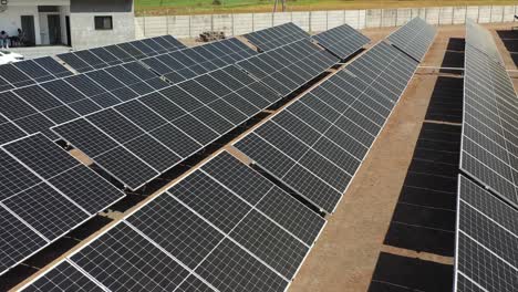 aerial footage solar energy modules or panels rows along the dry.4k video