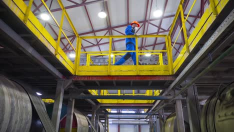 industrial worker on elevated platform