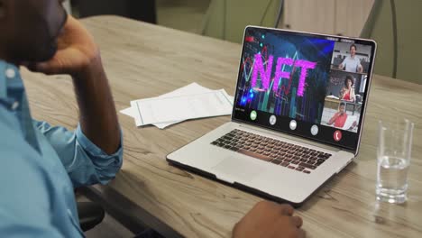 African-american-businessman-using-laptop-for-video-call-with-diverse-business-colleagues