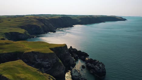 Sweeping-Aerial-Views-of-the-Britain's-Coastline,-Cliffside-Beauty-of-St-Abbs-Head,-Rugged-Cliffs-in-Rural-Scotland,-British-Isles