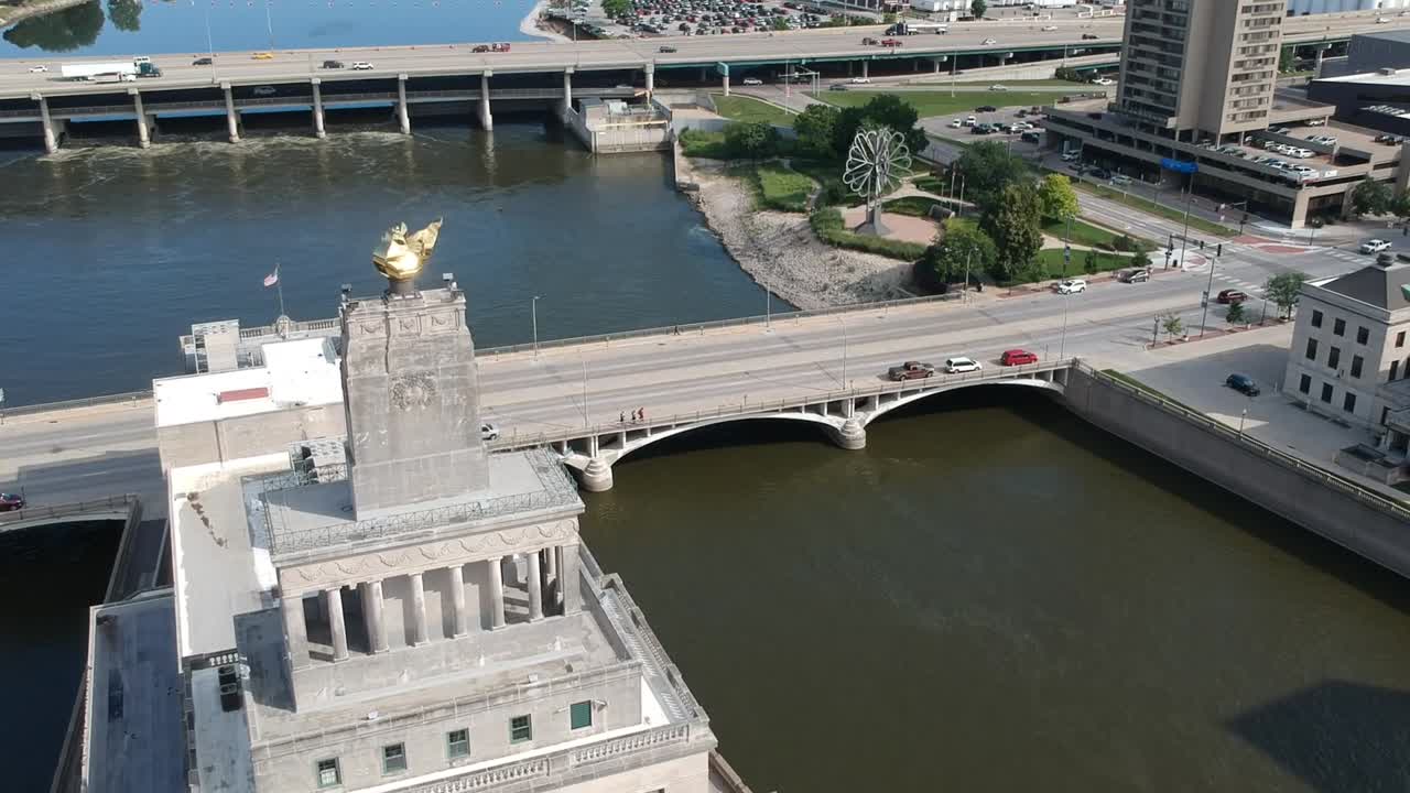 DJI Spark flying in a downtown Midwest City. City is located on the river with pretty buildings and great shots of city architecture.