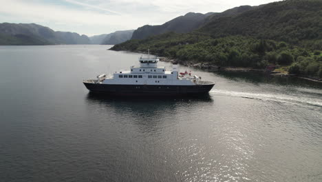 aerial side view of a car ferry crossing a beautiful fjord in norway, lauvvika-oanes, near stavanger, summer sunny day