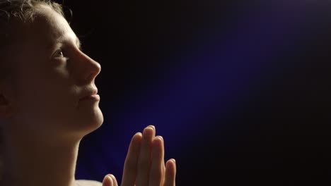 close up view of a woman praying- woman meditating