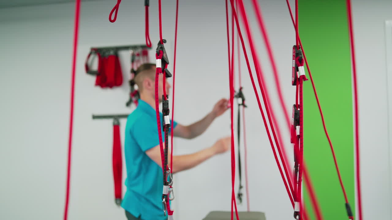 Physiotherapist working in clinic. Male doctor working in rehabilitation center