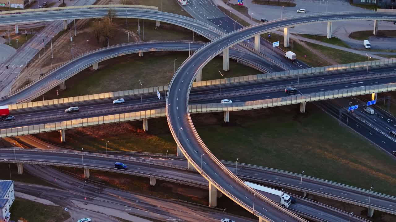 Elevated highways in Riga, moving vehicles, warm sunrise, Baltic infrastructure