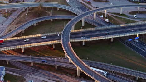elevated highways in riga, moving vehicles, warm sunrise, baltic infrastructure