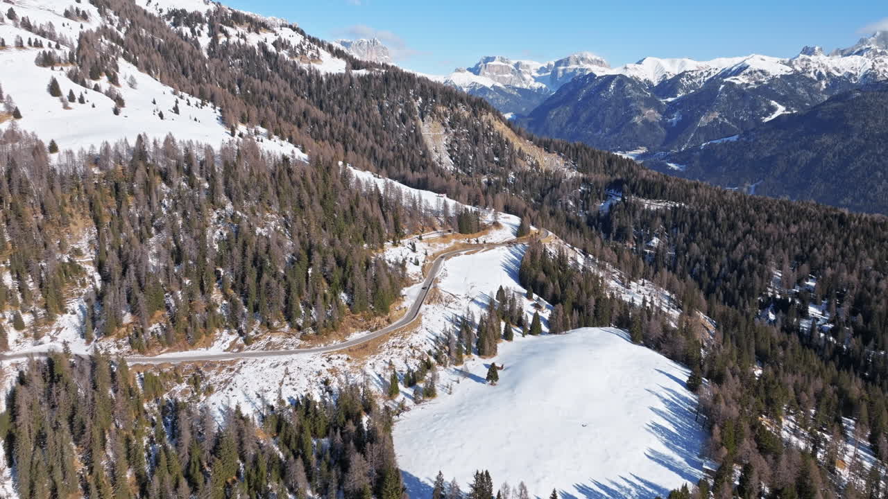 Aerial drone view of snow on the mountains in the Dolomites, Italy