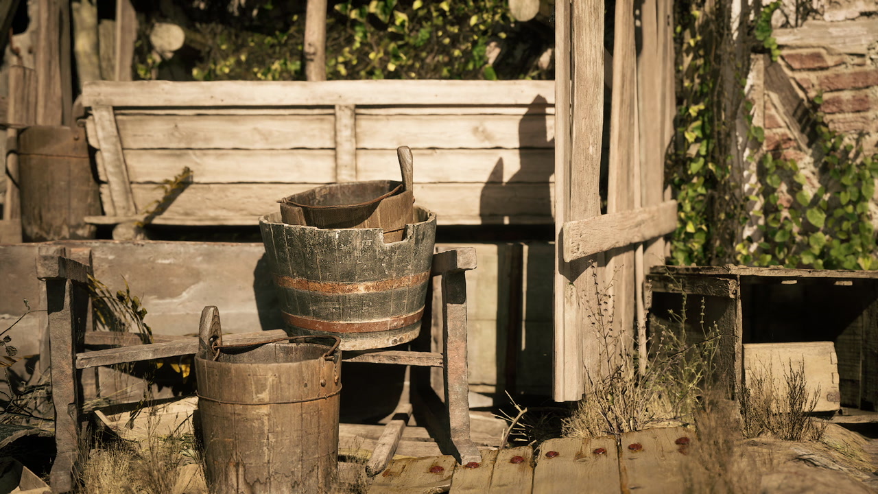 Rustic wooden buckets resting on a weathered porch surrounded by greenery