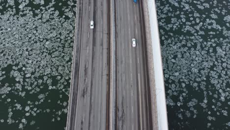 Rare-iceberg-circular-fungi-algae-bubbles-headed-west-at-a-birds-eye-view-over-a-quiet-vintage-Quesnel-bridge-traffic-North-and-South-over-the-North-Saskatchewan-River-Edmonton-Alberta-Canada-1-3