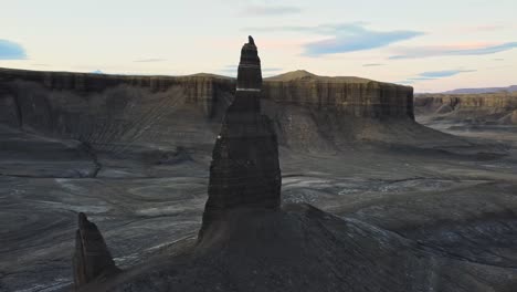 sharp rock formations in mountainous valley under sunset sky