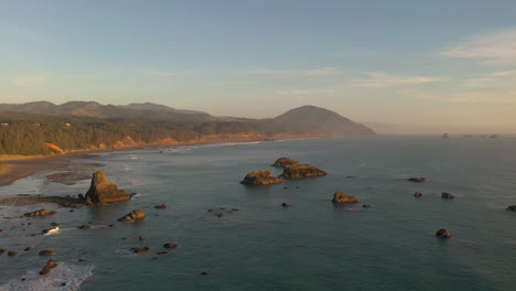 Sea-stacks-near-Port-Orford-with-Humbug-mountain-in-background