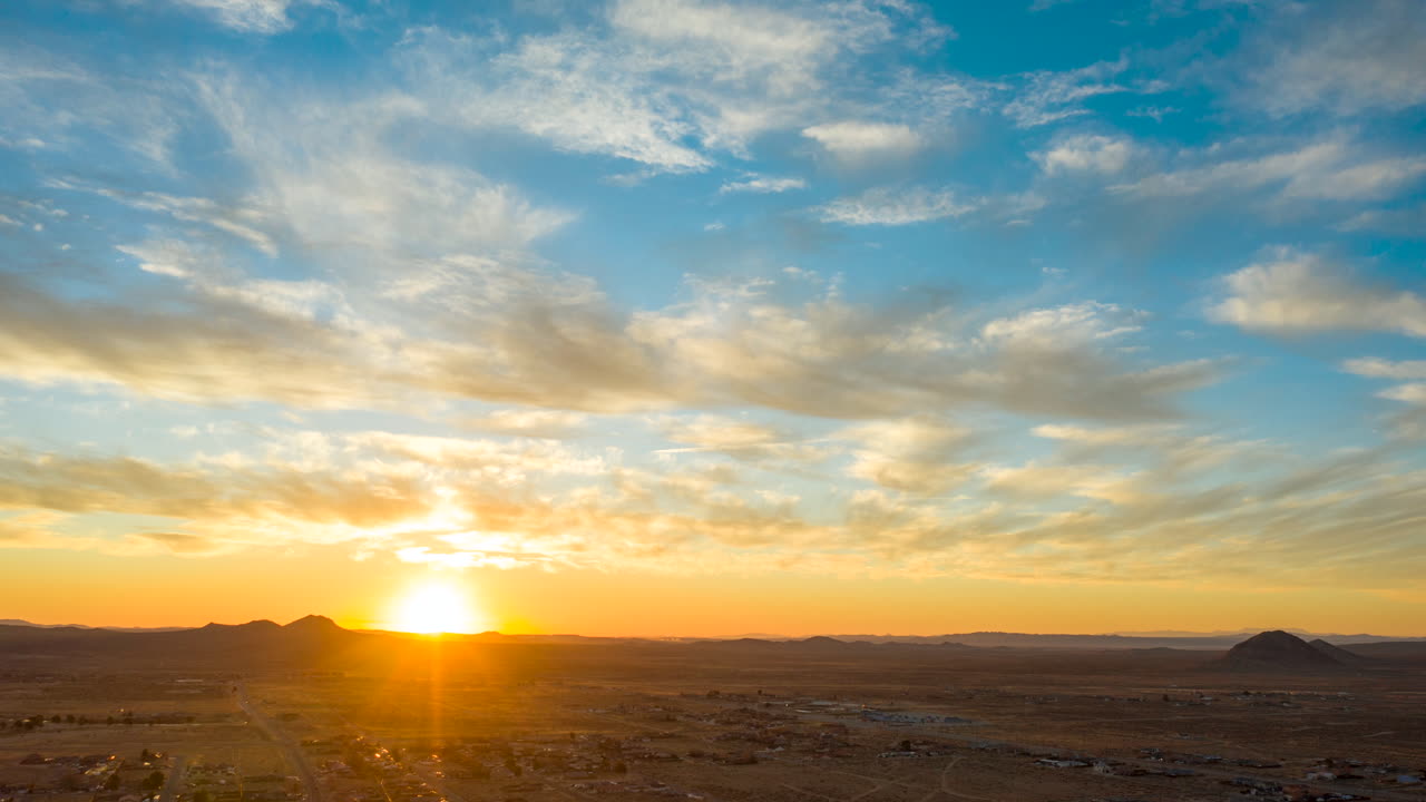 Sunrise time lapse over California City in the Mojave Desert as seen from a drone at high altitude