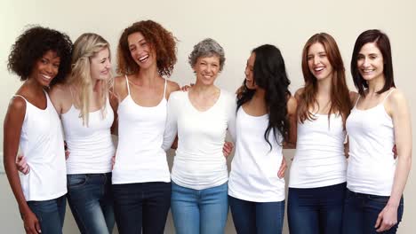 happy women hugging in a row