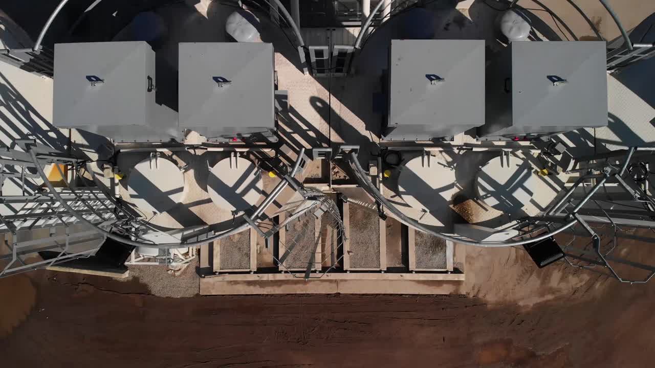 Aerial top down view of a concrete mixing plant on the highway intersection construction site