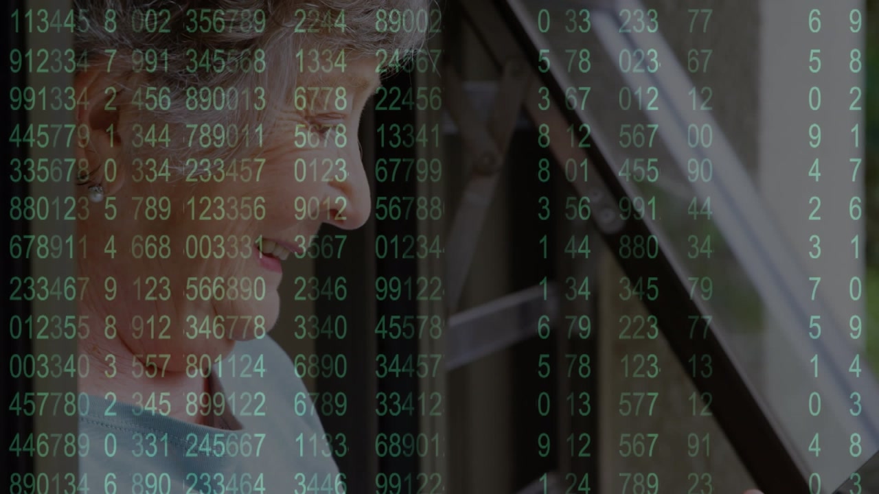 Animation of increasing numbers over senior caucasian woman using digital tablet at home