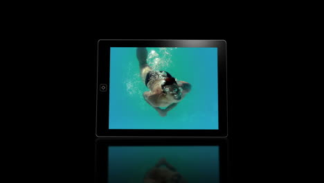 media device screens showing girl swimming