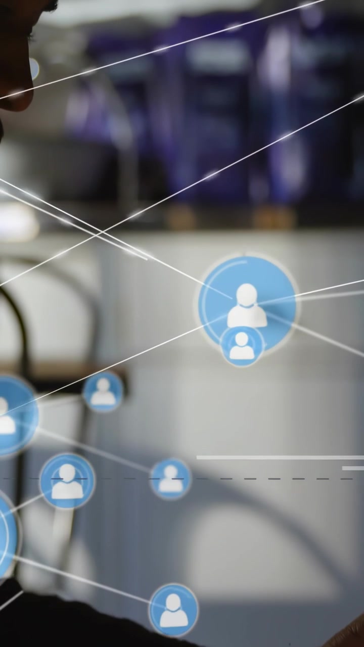 Vertical video: Man in purple moving in as blue icon appearing into network over face for marketing