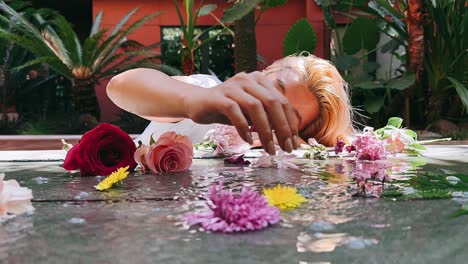 woman interacting with flowers in a garden