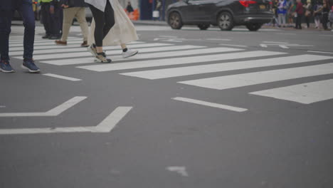 people crossing a city street