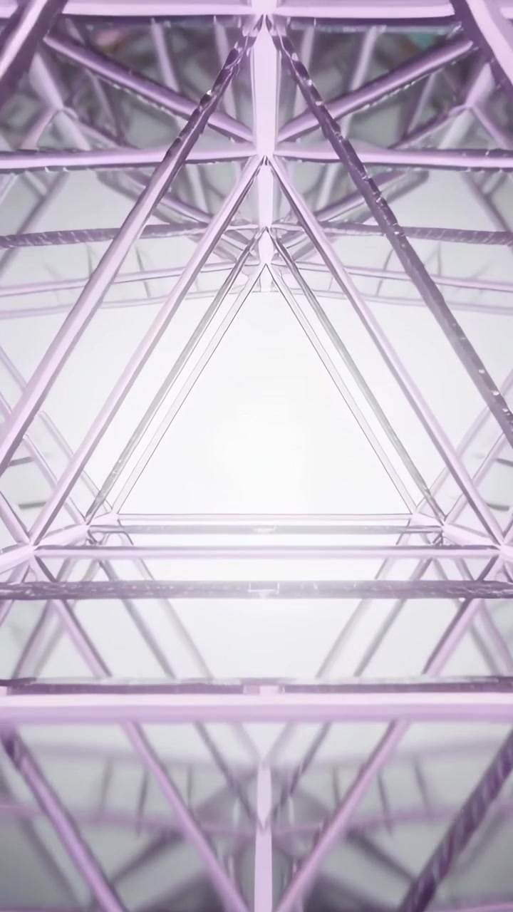 Vertical video: Moving camera drawing to bright light through metal truss tunnel as frames progress
