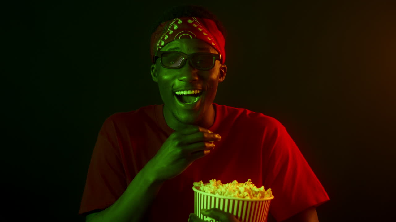 Man Enjoying a Movie with Popcorn