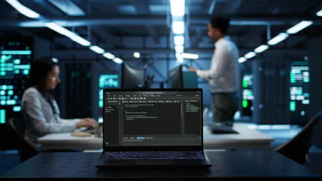 close up of code running on laptop screen in data center
