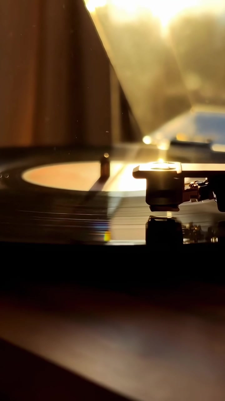 Vinyl Record Spinning on Turntable in Warm Sunlight