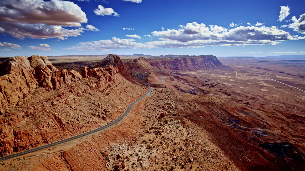 Captivating drone pass skimming the rugged cliffside, exposing the immense drop-off near Antelope Pass Vista on Highway 89.