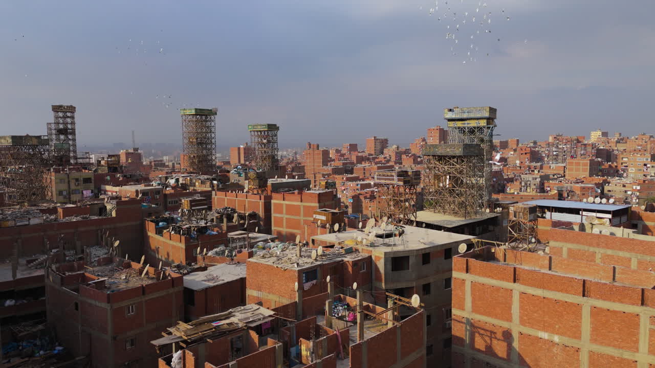 Rooftops and trash heaps in Garbage City - aerial