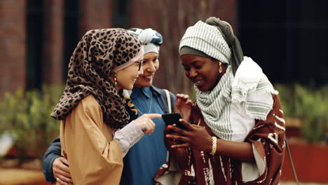 islamic women taking selfie outdoors