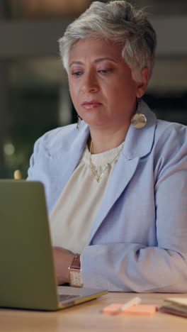 woman working on her laptop in an office