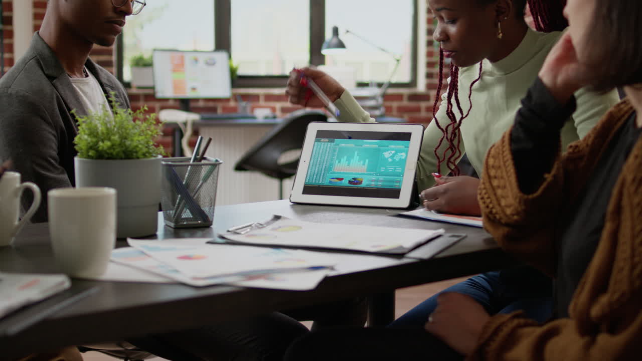 Diverse team of coworkers meeting to work on startup project